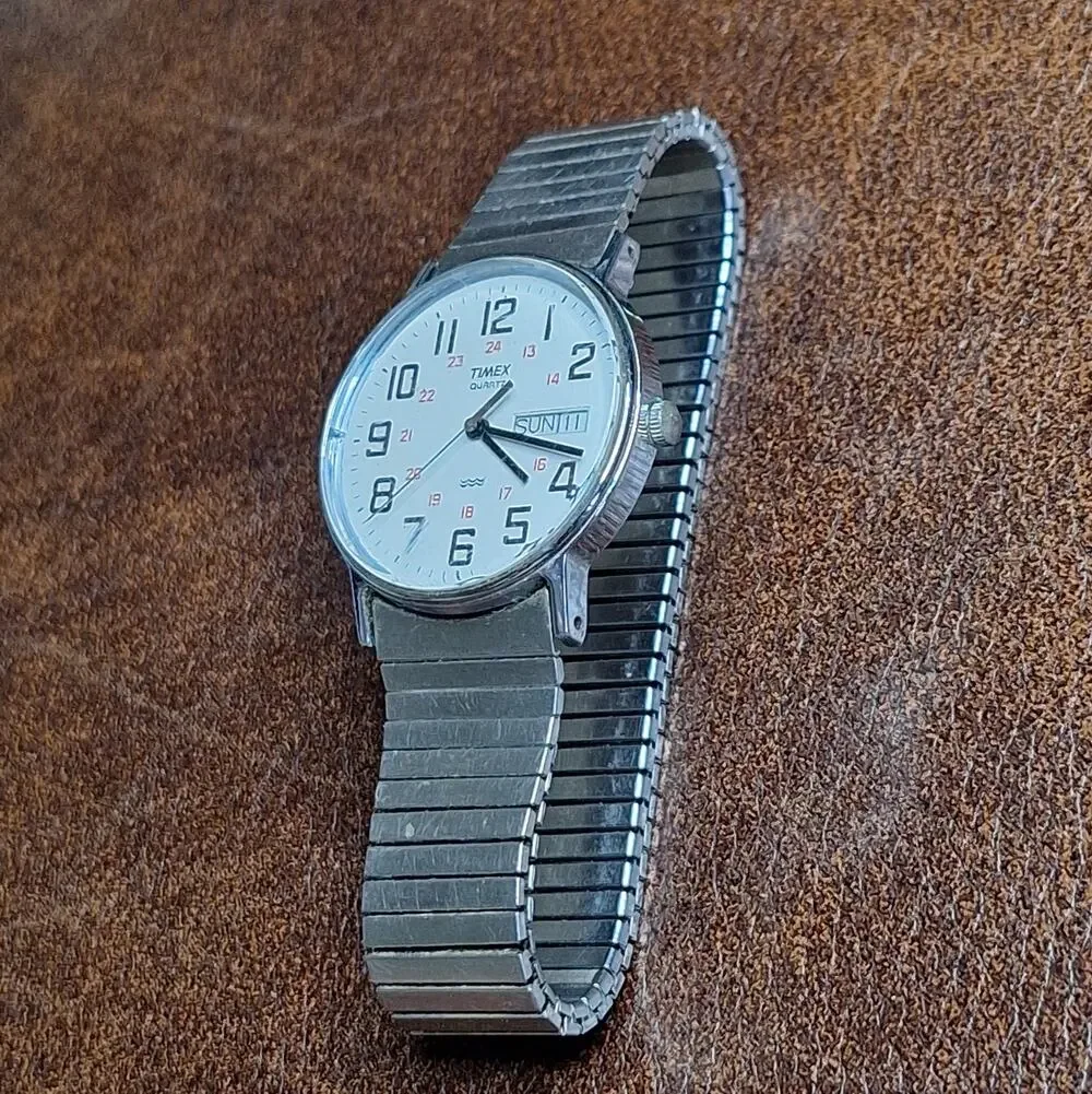 VTG Timex Quartz Day Date Watch Silver Tone White Dial Running Stretch Band 395